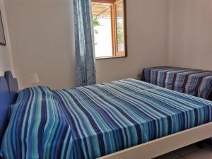 Postel nebo postele na pokoji v ubytování ANFORA Blu