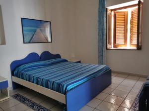 Postel nebo postele na pokoji v ubytování ANFORA Blu