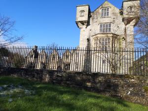 a fence in front of an old castle at O'Donnell's Of Donegal in Donegal