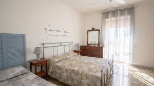 Кровать или кровати в номере VILLA SALINA MONACI