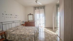 Кровать или кровати в номере VILLA SALINA MONACI