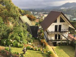 a house on a hill with a garden at Sherwood Cottage in Nuwara Eliya