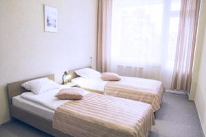 Postel nebo postele na pokoji v ubytování Daina Jurmala Beach Hotel