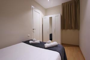 Postel nebo postele na pokoji v ubytování MUNNE - Spacious apartment FC Barcelona