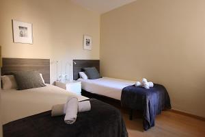 Postel nebo postele na pokoji v ubytování MUNNE - Spacious apartment FC Barcelona
