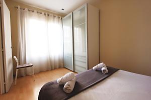 Postel nebo postele na pokoji v ubytování MUNNE - Spacious apartment FC Barcelona