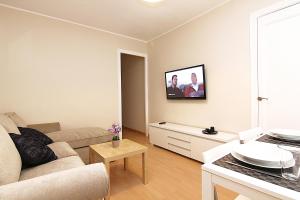TV a/nebo společenská místnost v ubytování MUNNE - Spacious apartment FC Barcelona
