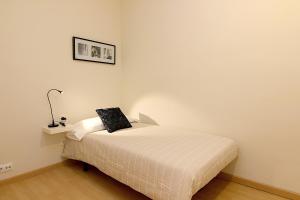 Postel nebo postele na pokoji v ubytování MUNNE - Spacious apartment FC Barcelona