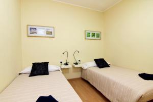 Postel nebo postele na pokoji v ubytování MUNNE - Spacious apartment FC Barcelona