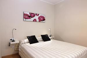 Postel nebo postele na pokoji v ubytování MUNNE - Spacious apartment FC Barcelona