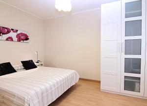 Postel nebo postele na pokoji v ubytování MUNNE - Spacious apartment FC Barcelona