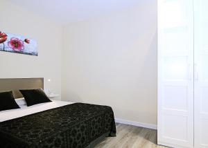 Postel nebo postele na pokoji v ubytování MUNNE - Spacious apartment FC Barcelona