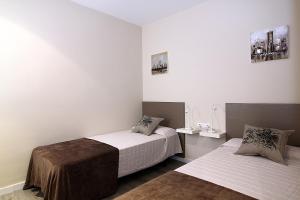 Postel nebo postele na pokoji v ubytování MUNNE - Spacious apartment FC Barcelona