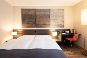 Voodi või voodid majutusasutuse Altstadt Hotel toas