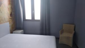 Voodi või voodid majutusasutuse B&B Vecchia Darsena toas