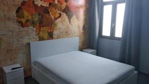 Voodi või voodid majutusasutuse B&B Vecchia Darsena toas
