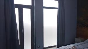 Voodi või voodid majutusasutuse B&B Vecchia Darsena toas