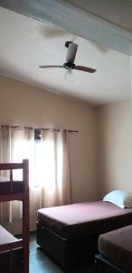 Postel nebo postele na pokoji v ubytování Chácara Felicidade