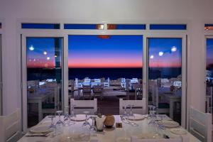 a dining room with a view of the ocean at Westpoint Dakhla in Dakhla