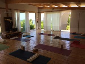 a room with a bunch of yoga mats on the floor at Angeli di Montefiore in Montefiore dellʼAso
