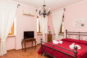 Postel nebo postele na pokoji v ubytování B&B Da Natalina