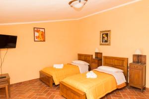 Postel nebo postele na pokoji v ubytování B&B Da Natalina