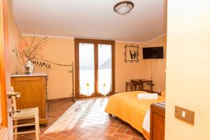 Postel nebo postele na pokoji v ubytování B&B Da Natalina