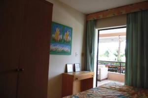 a bedroom with a bed and a sliding glass door at Aquaville - Porto das Dunas in Aquiraz +64 photos