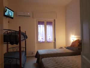 Postel nebo postele na pokoji v ubytování B&B Confine