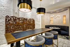 a dining room with a table and chairs at Hotel Indigo Kansas City - The Crossroads, an IHG Hotel in Kansas City