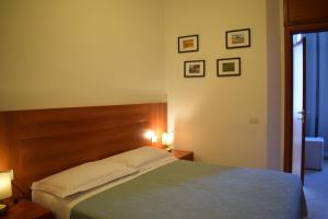 A bed or beds in a room at Hotel Dalmazia