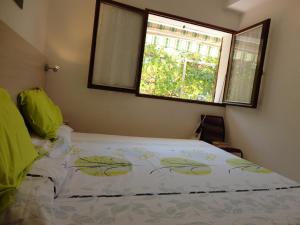 Hôtel Punta e Mare des Chambres ou des Appartements T2客房内的一张或多张床位