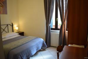 A bed or beds in a room at Hotel Dalmazia