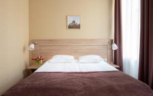 
Кровать или кровати в номере Невский Гранд Энерджи
