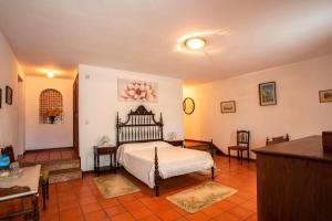 a bedroom with a bed in a room at Casa da Várzea in Beiral do Lima