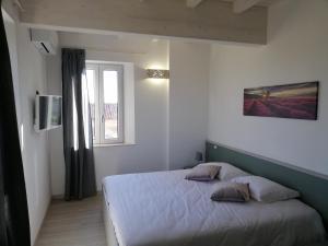 Postel nebo postele na pokoji v ubytování Claudio Rooms