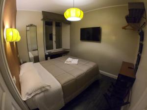 Ein Bett oder Betten in einem Zimmer der Unterkunft Residenza Roma Imperiale