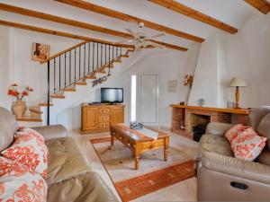 a living room with a couch and a table at Villa Robinson by Interhome in Pedreguer