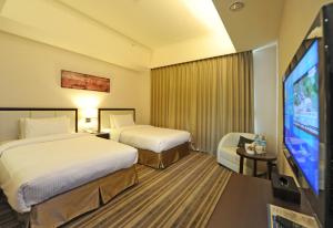 Postel nebo postele na pokoji v ubytování F Hotel - Hualien