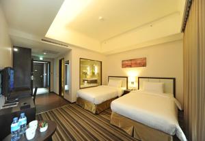 Postel nebo postele na pokoji v ubytování F Hotel - Hualien