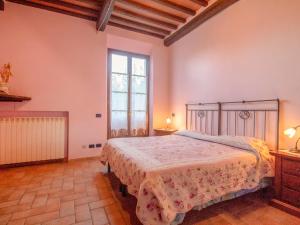Ένα ή περισσότερα κρεβάτια σε δωμάτιο στο Holiday Home Podere Gioia by Interhome