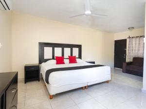 Cama ou camas em um quarto em Hotel Jardín Cancún