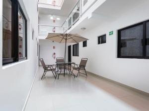 Uma varanda ou outra área externa em Hotel Jardín Cancún