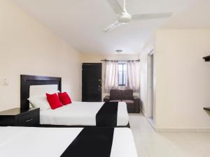Cama ou camas em um quarto em Hotel Jardín Cancún