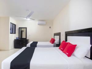 Cama ou camas em um quarto em Hotel Jardín Cancún