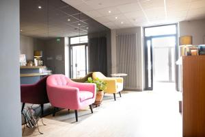 Posezení v ubytování L'Aptois Hôtel