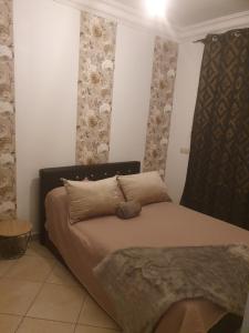Postel nebo postele na pokoji v ubytování Appartement avec piscine, 1min de la plage
