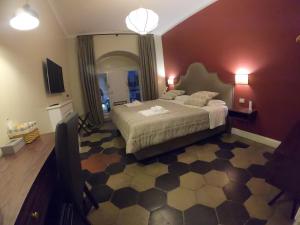 Ein Bett oder Betten in einem Zimmer der Unterkunft Residenza Roma Imperiale