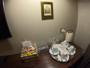 a table with a tea set on top of it at Residenza Roma Imperiale in Rome