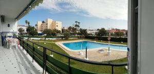 a view of a swimming pool from a balcony at Casa Sardinero in Torremolinos